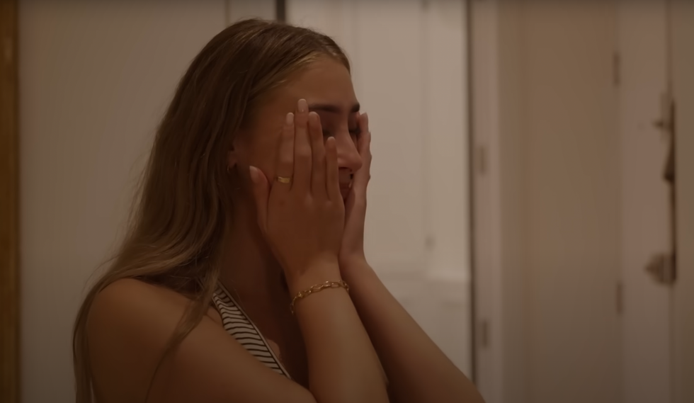 Lily Phillips crying and collecting herself while being interviewed by documentary crew