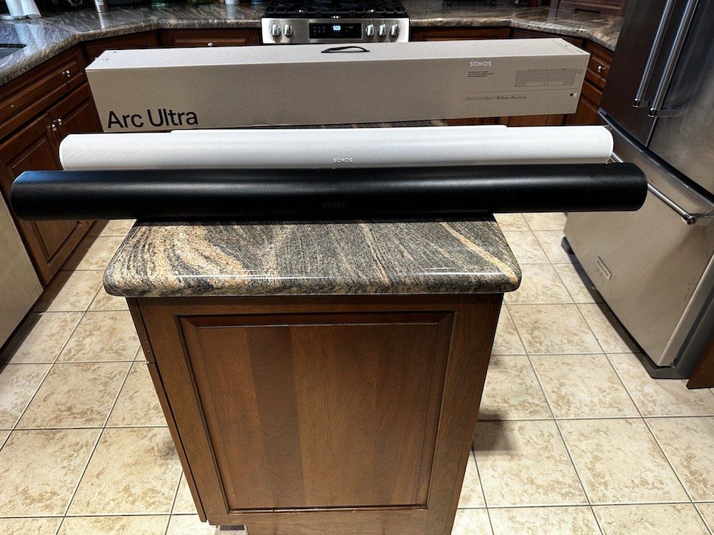 a photo of Sonos Arc and Arc Ultra Soundbars on a counter