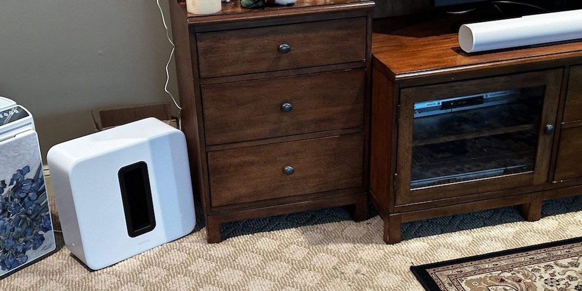 a photo of Sonos Arc Ultra soundbar and Sonos Sub 4 woofer