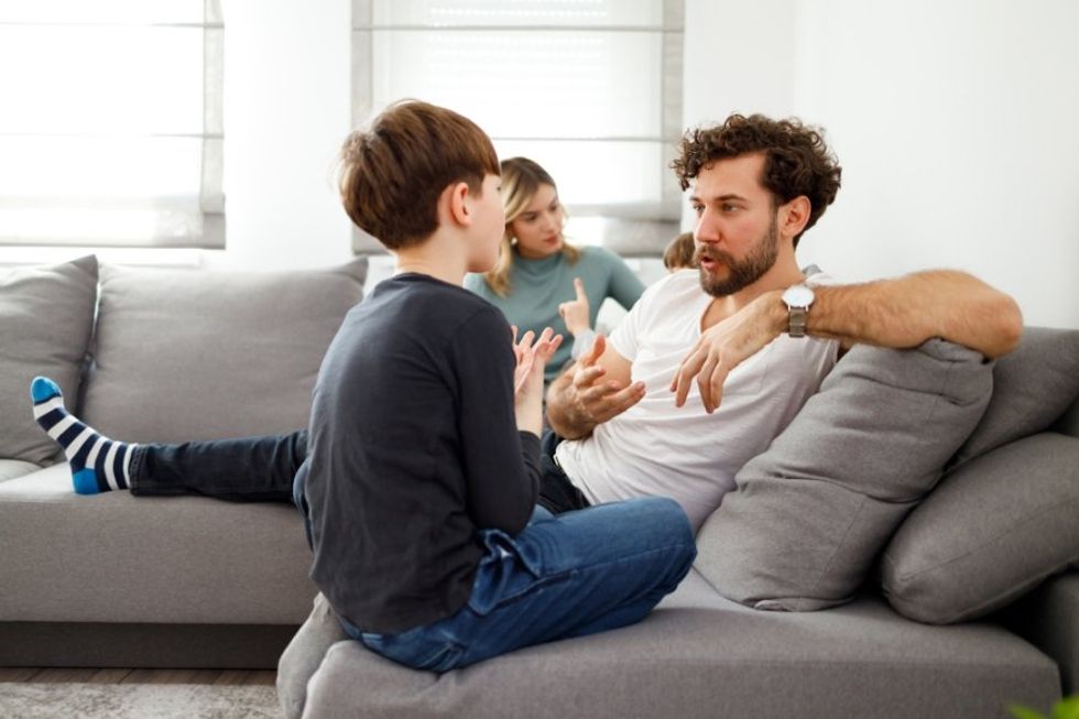 dad talking to a son