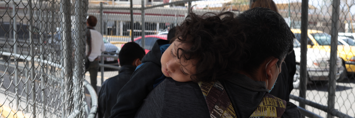 immigrant mother holding a child