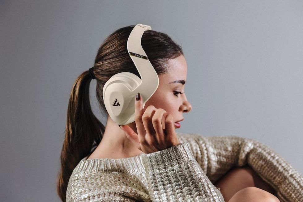 a woman wearing LIVV Pro headphones photo