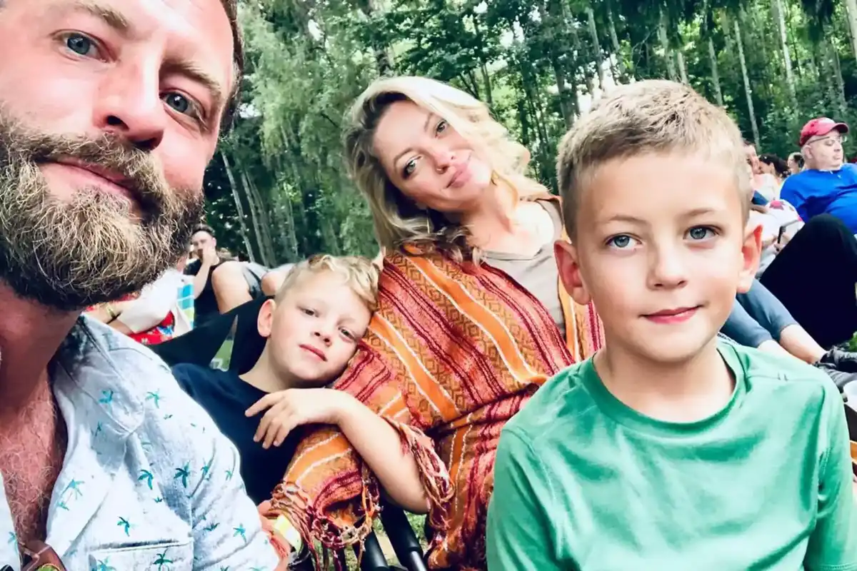 Young family takes a photo outside
