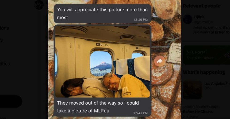 Couple on a bullet train joyfully ducking for a stranger's photo brings joy to millions