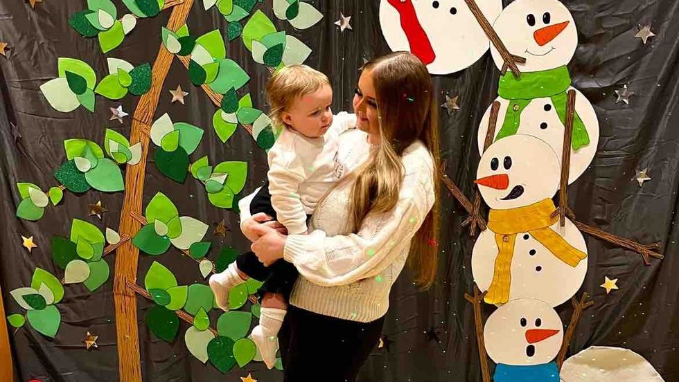 Woman holds baby