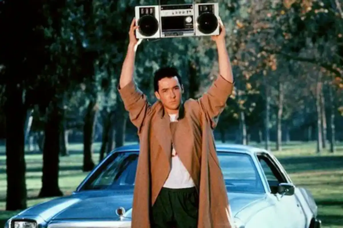 John Cusack holding a boombox over his head in "Say Anything"