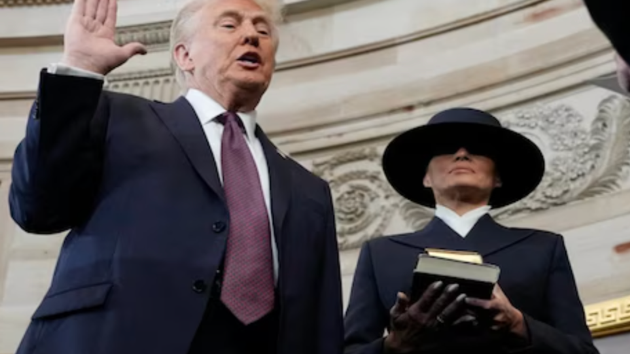 'Saved By God' -- But Trump Doesn't Touch Bible As He Takes Oath