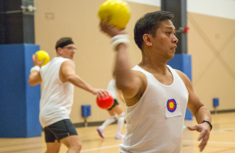 Men playing dodgeball