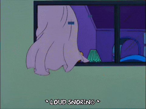 Homer Simpson snores loudly, and Marge looks concerned
