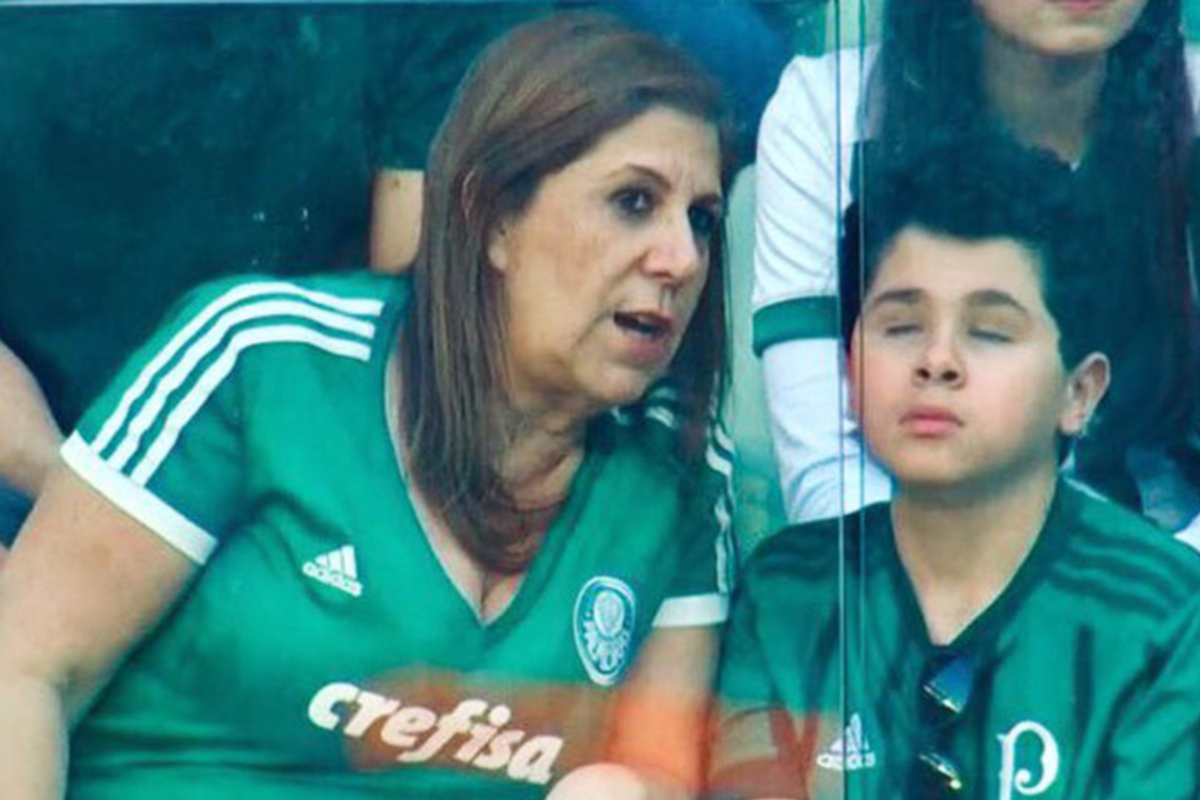 Silvia Grecco describing a soccer match to her blind son at the arena.