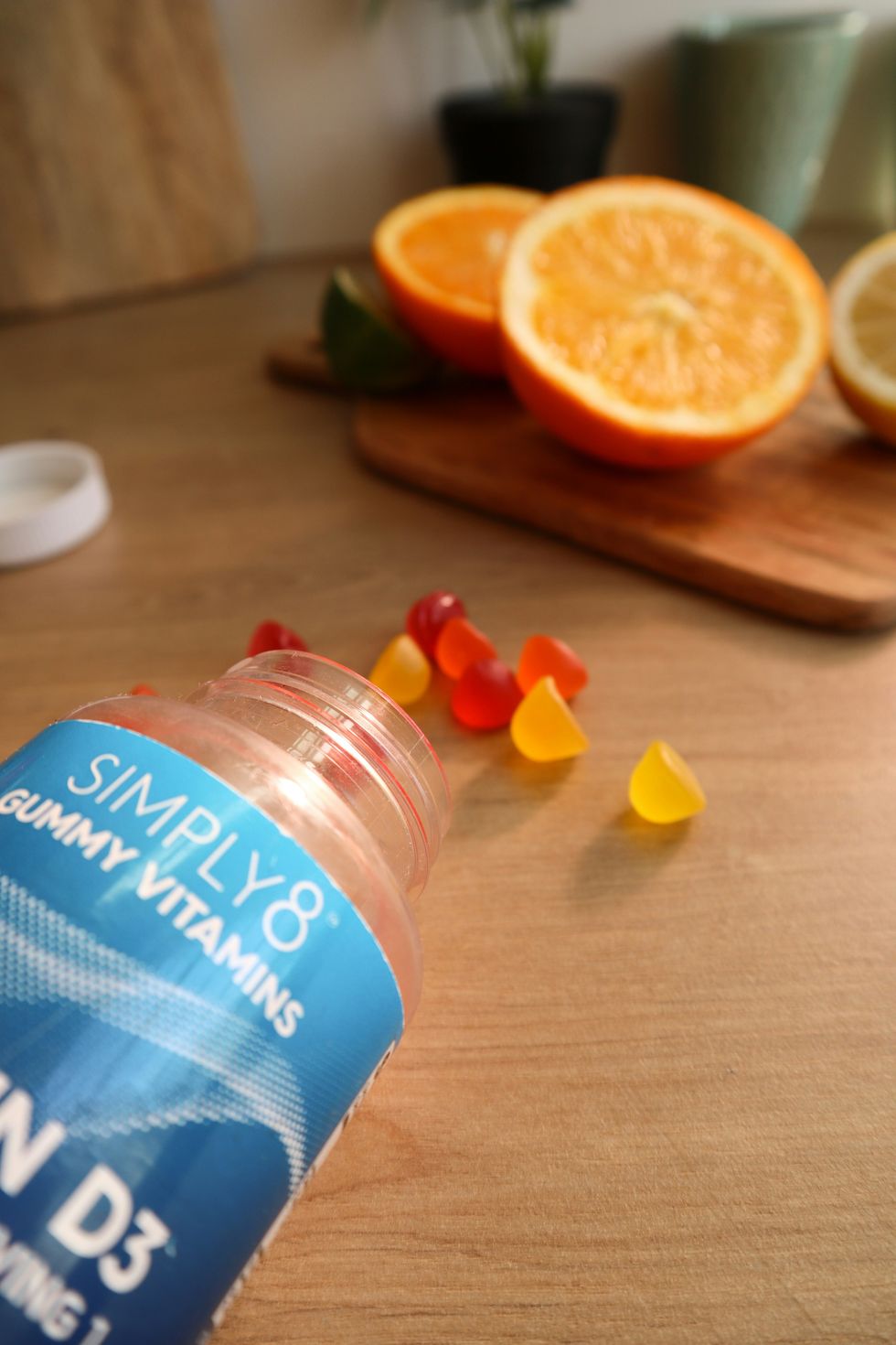 a bottle of vitamin water sitting on top of a wooden table