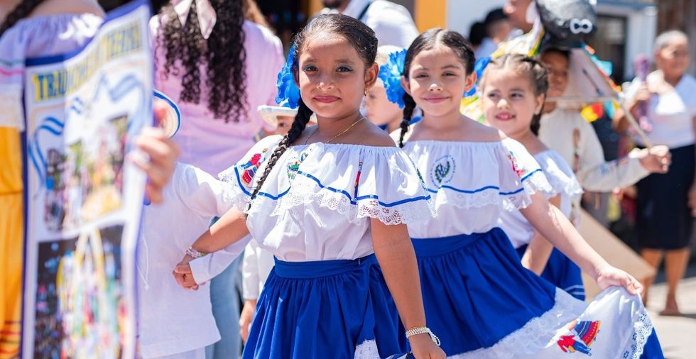 Dad shares joyful celebration of America's diversity in his kids' school Parade of Nations