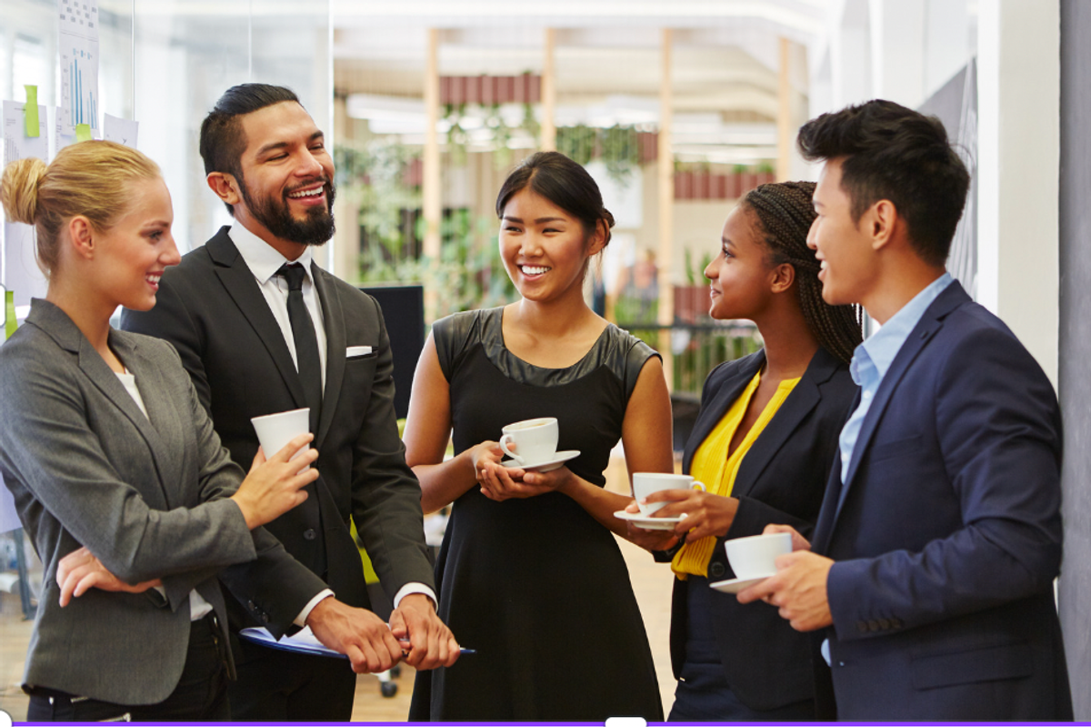 group of young professionals talking with tea