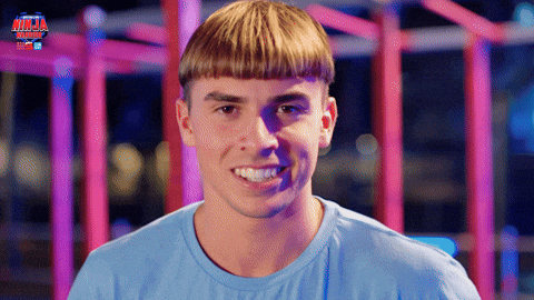 man shaking out his bowl cut