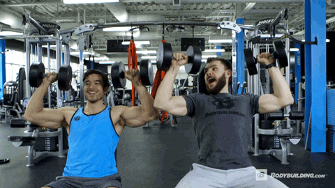 gif of two men lifting weights together
