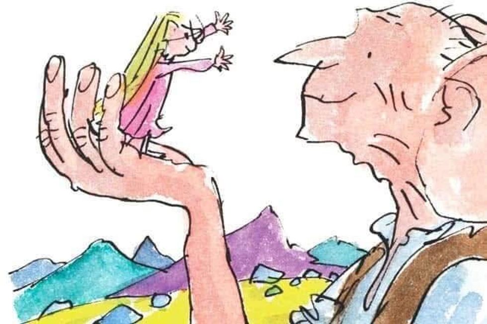 one of Roald Dahl's drawings of the Big Friendly Giant holding a little girl.