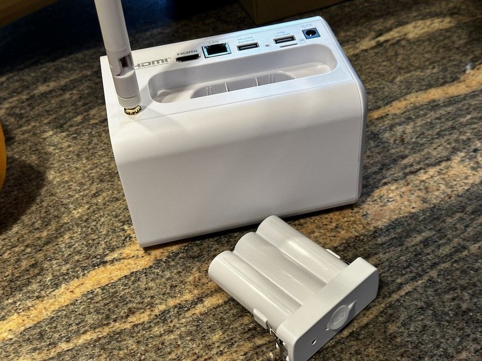 a photo of swann hub and its back up battery