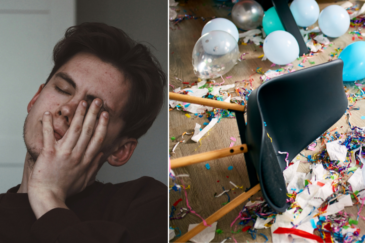 man sitting with hand over his face; fallen chair among balloons, streamers, and paper
