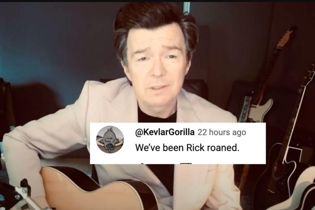 singer Rick Astley in a tan suit playing guitar behind a comment that reads, "We've been Rick Roaned."