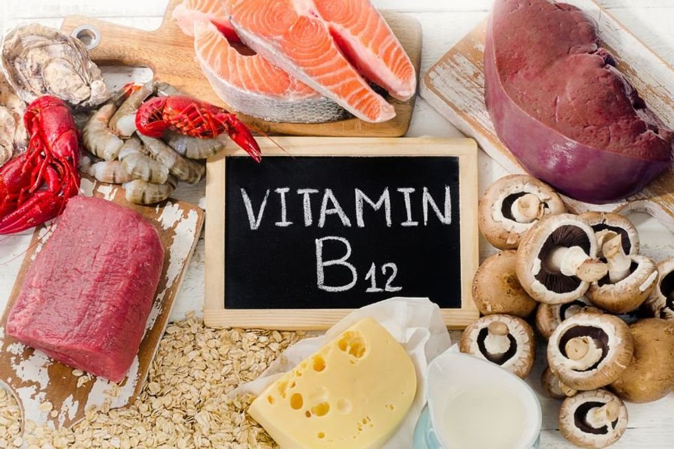 collection of foods around a sign that says, "Vitamin B12"