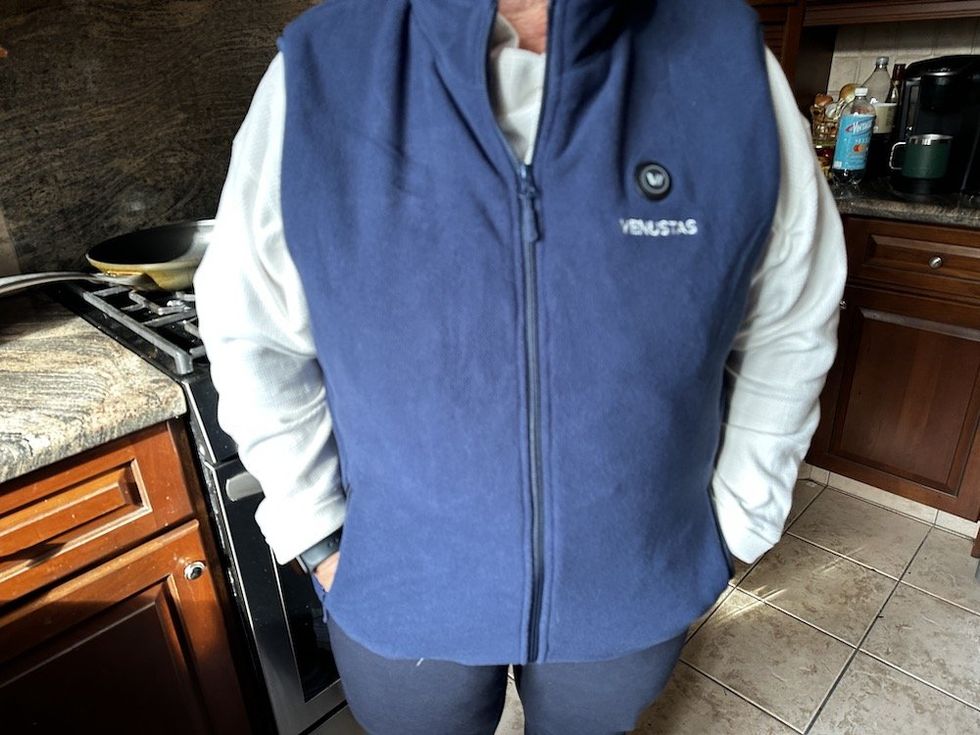 a photo of a woman wearing Venustas Women\u2019s Heated Lightweight Puffer Jacket 7.4V