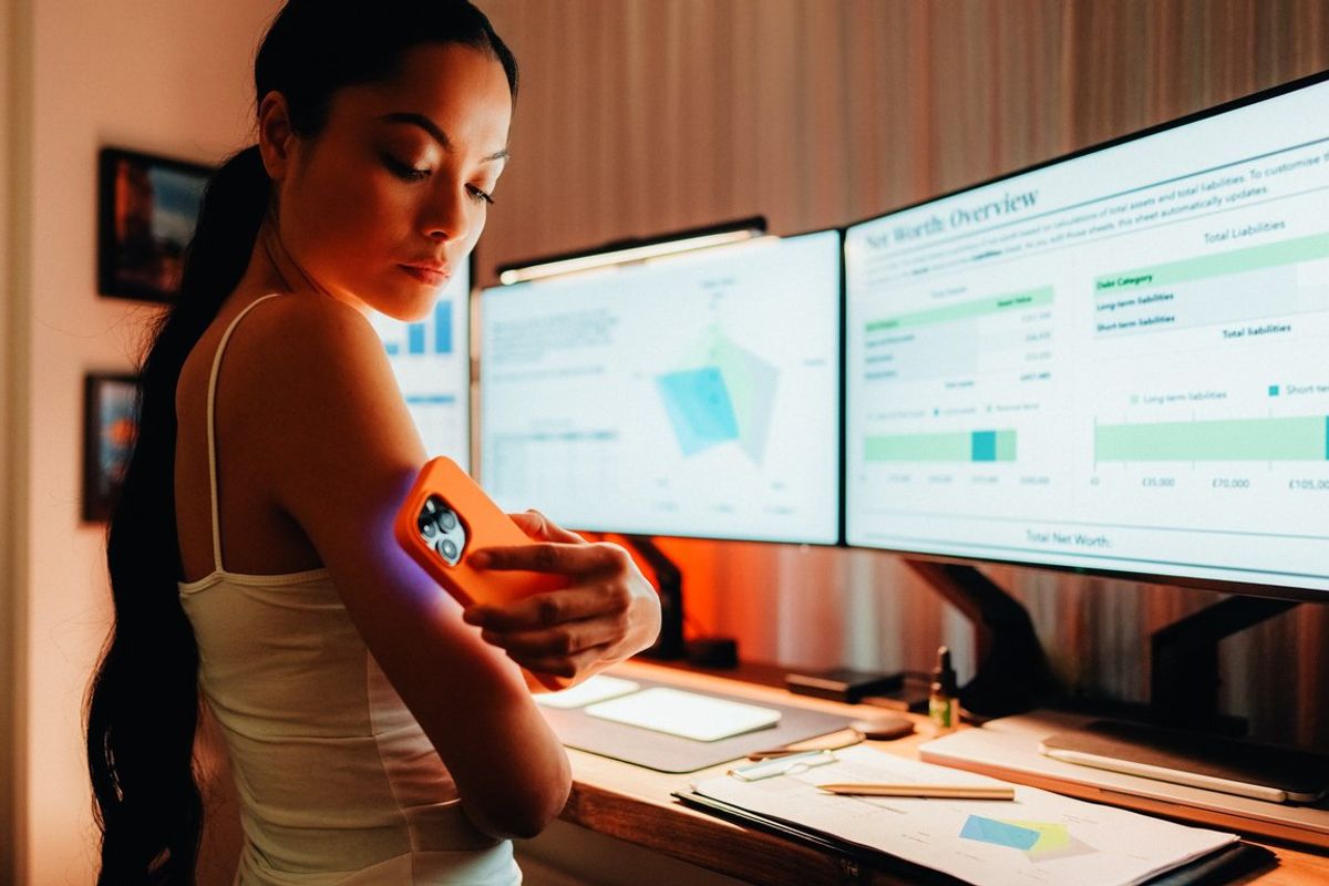 Day in the life of woman with diabetes working from home stock photo