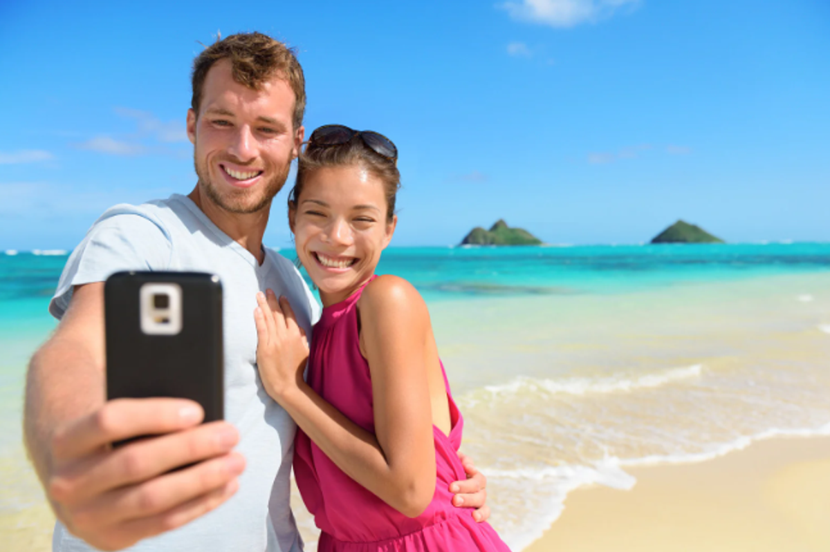 A couple taking a selfie on vacation.