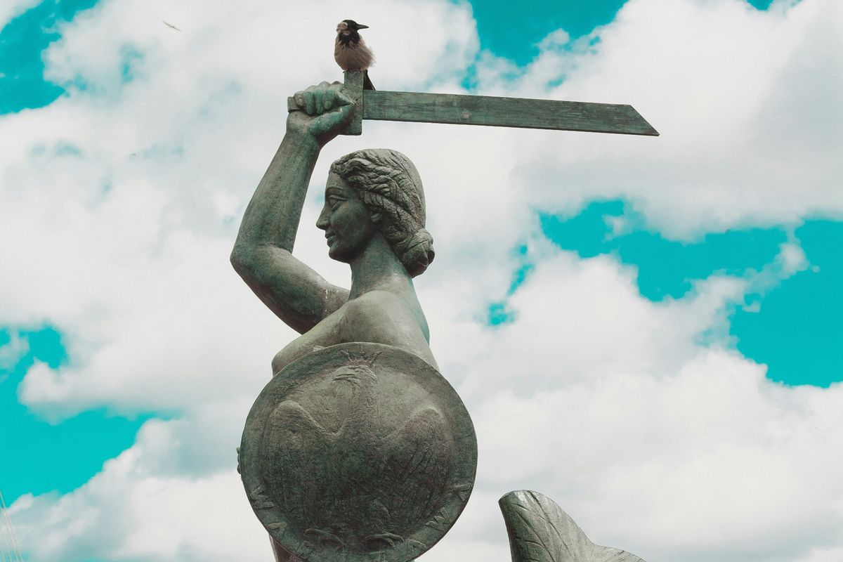 angel statue under blue sky during daytime
