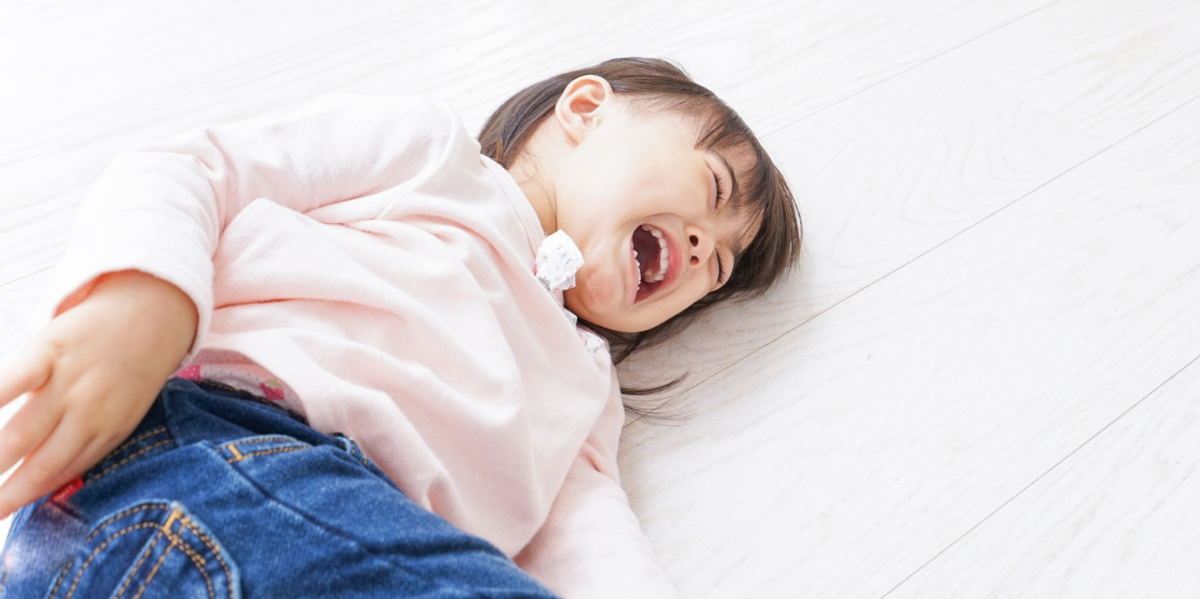 Child on floor crying