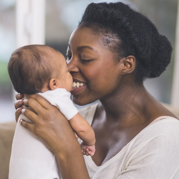 woman holding newborn baby