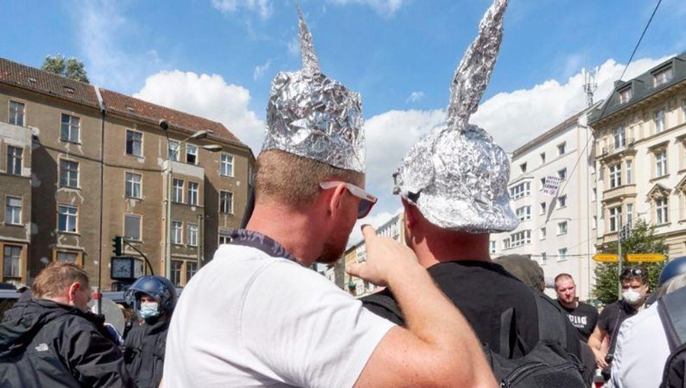 misinformation, conspiracy theories, tin foil hat, fake news, debunking false information