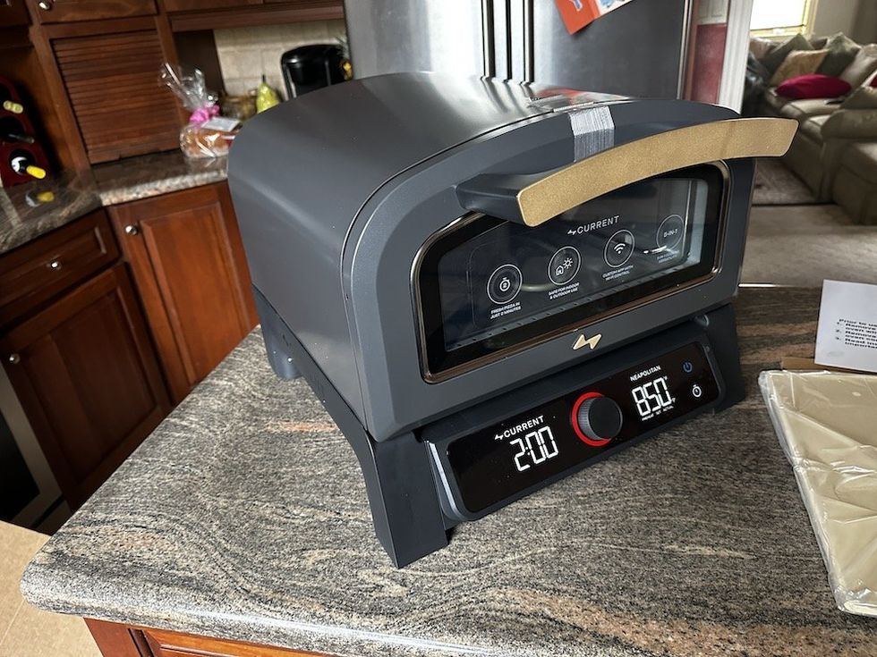 a photo of Current Backyard Model P Smart Pizza Oven on a kitchen counter