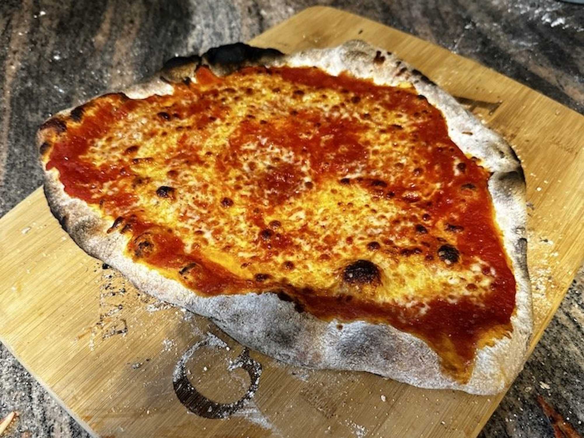 Pizza cooked in the Current Backyard Model P Smart Pizza Oven