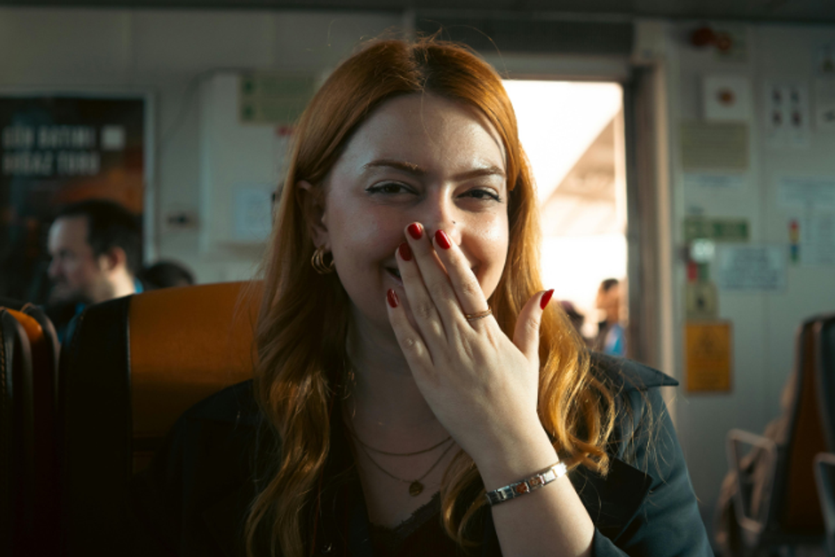 embarrassed woman, smirking woman, attracted woman, woman on vacation, redheaded woman, painted nails