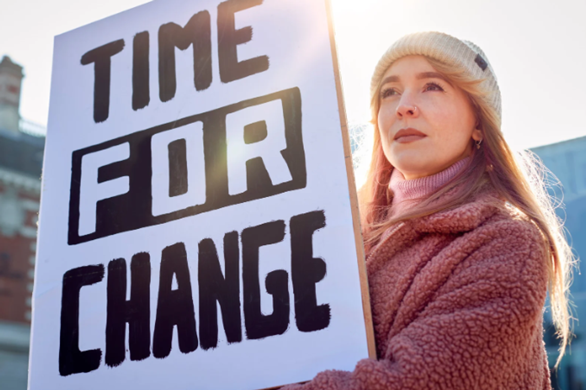 millennials, protest, woman 30s, change, protest, woman with sign