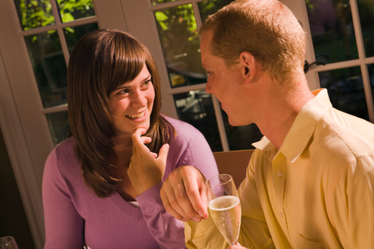woman talking, couple on date, woman smiling, champagne, conversation, uncomfortable silence