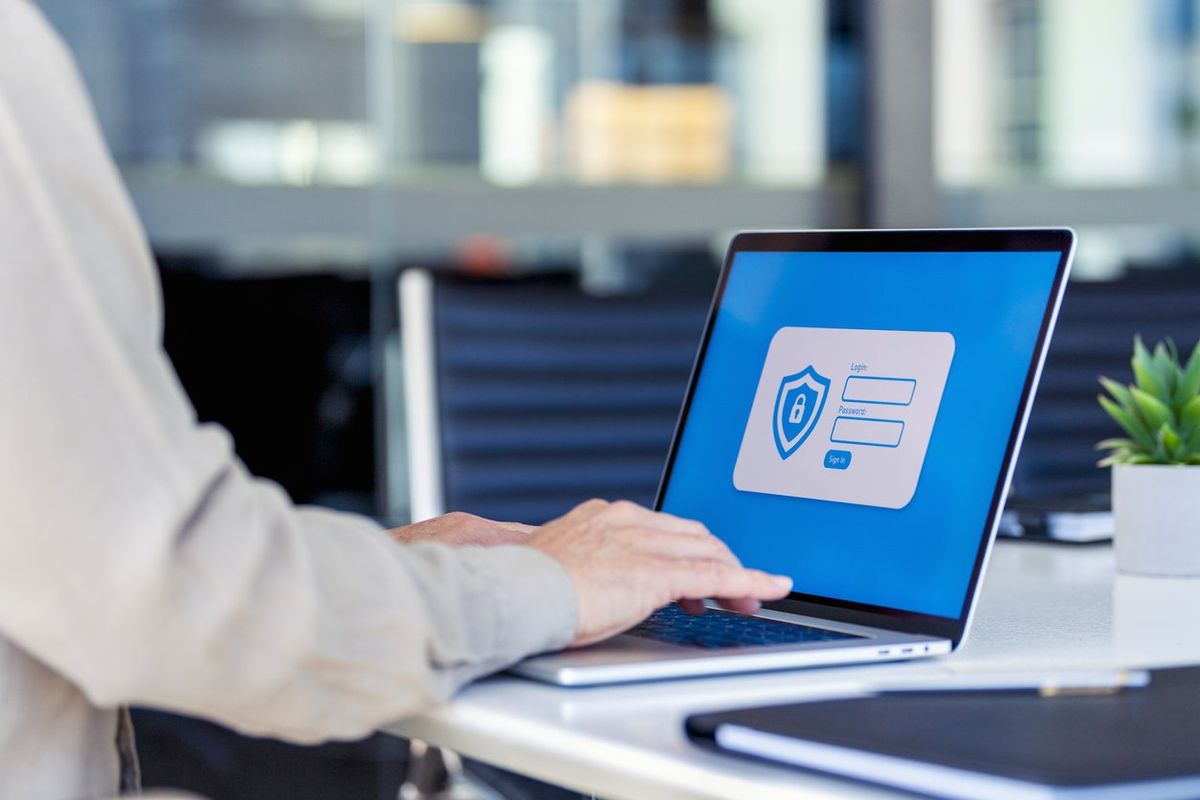 Businessman logging on to a password protected website stock photo