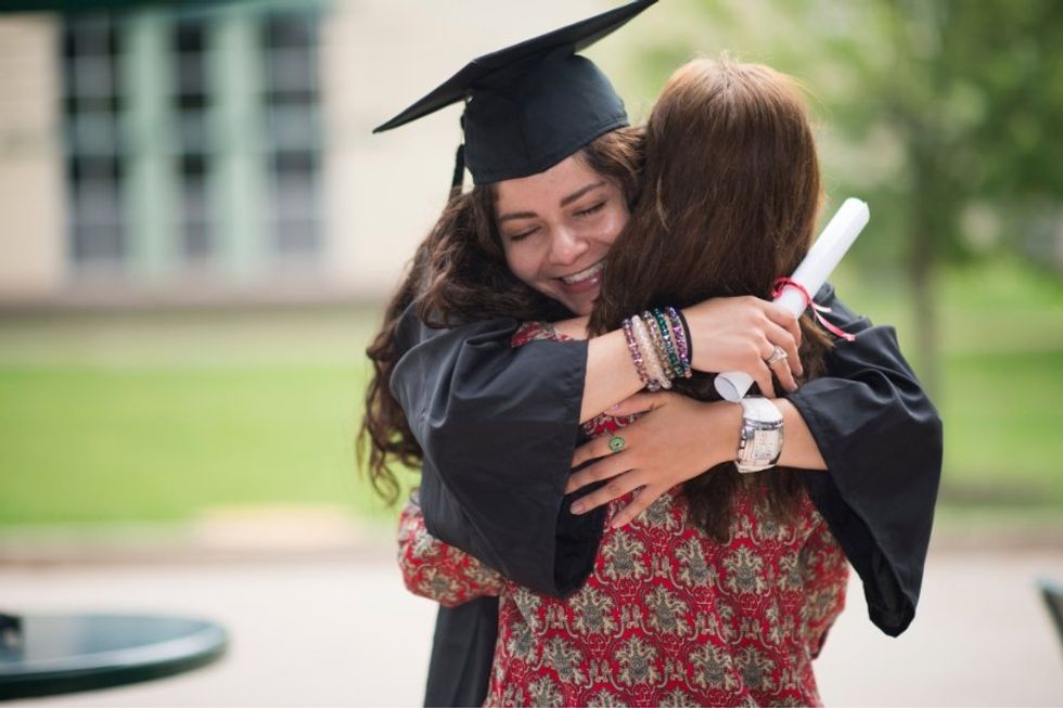graduation, graduate, cap and gown, hugging graduate