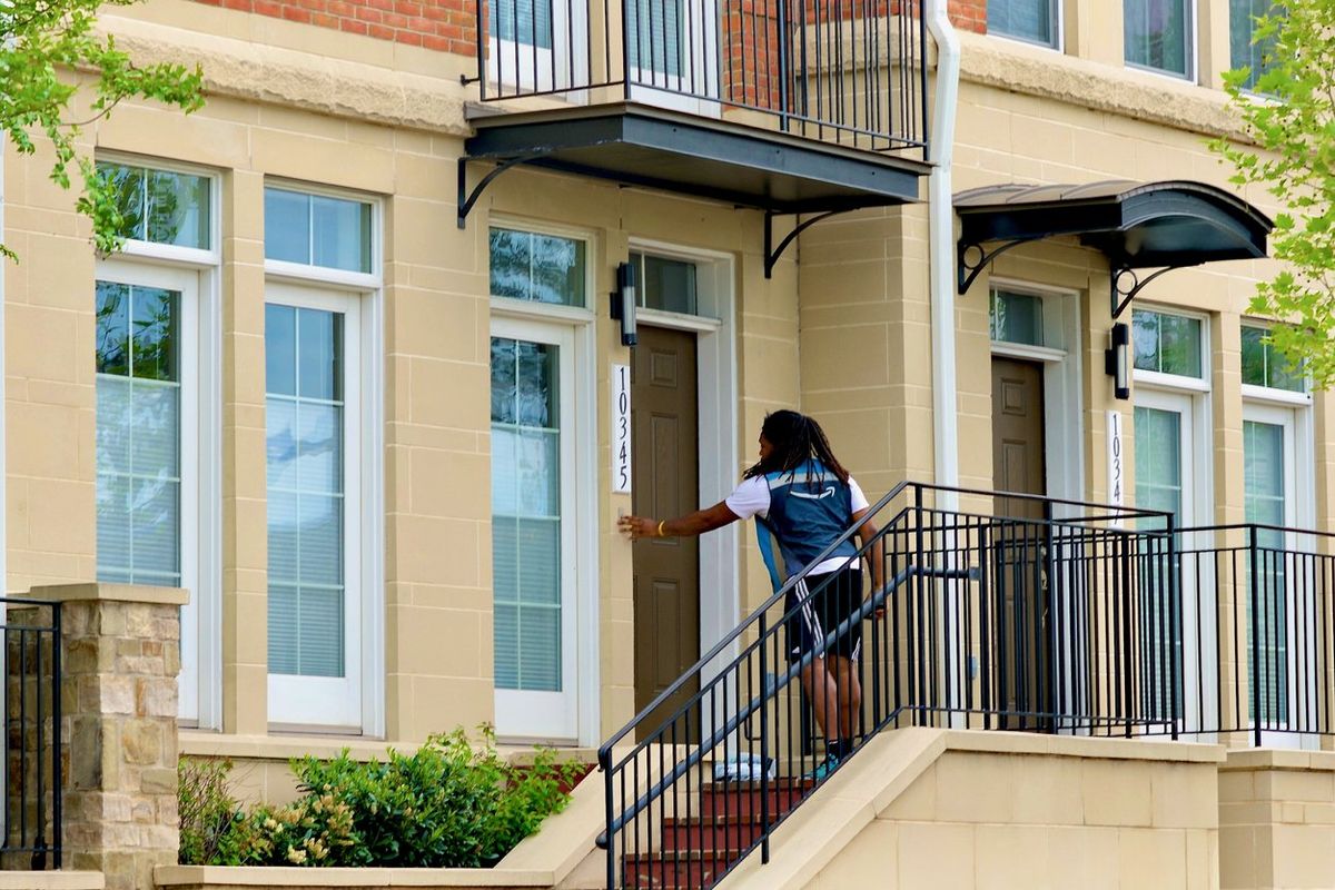 Amazon Driver Rings Doorbell stock photo