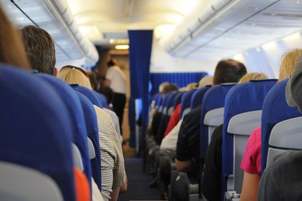 airplane seat; plane seat; entitled parents; man takes seat back; airlines; flight attendant
