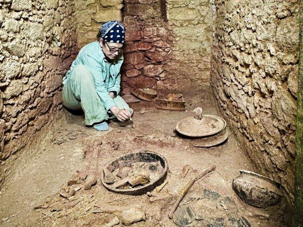 Diane Chase archaeologist in Mayan tomb