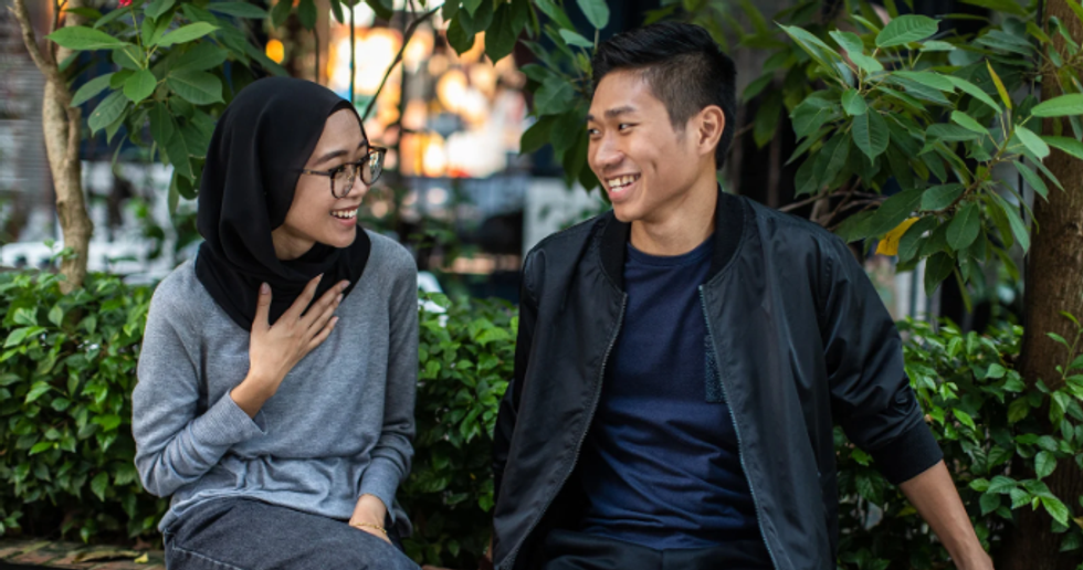 couple talking, man and woman talking, chit chat, small talk, couple on bench,