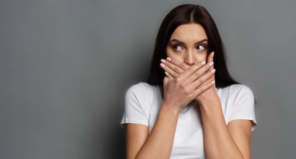 millennials, aging, the shift, shocked woman, woman hands over mouth, brunette woman,