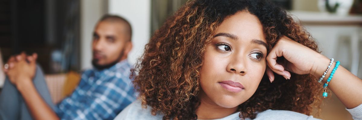 Frustrated couple, ignore and fight with argument on sofa for disagreement, conflict or living room dispute at home. Upset woman, man or separation with affair for breakup or toxic relationship