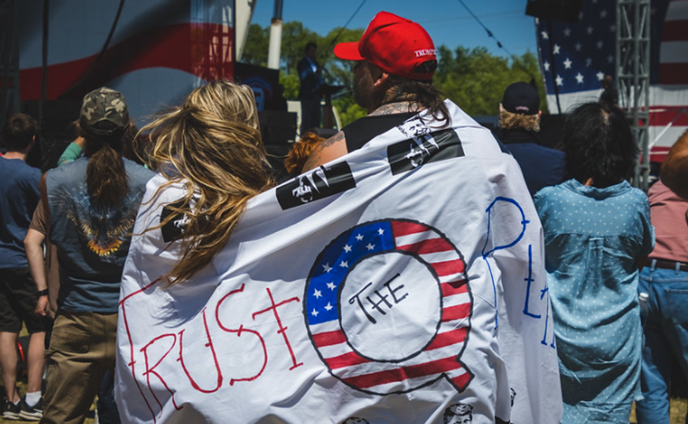 qanon, qanon rally, conspiracy theorists, qanon couple, qanon rally, q,
