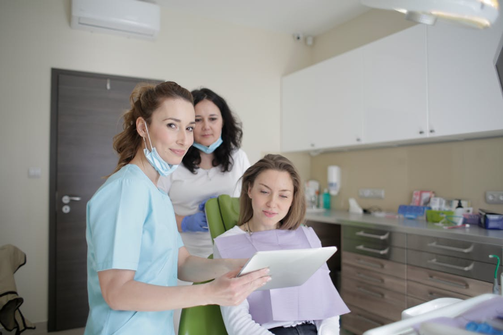 dentist talking to a patient photo