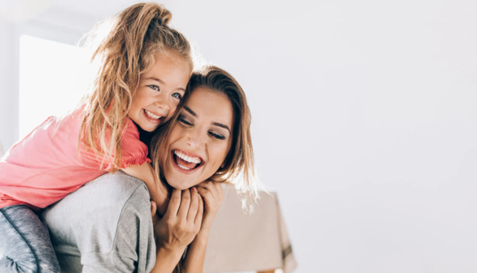 mom and daughter, little girl, mom, piggy back, hug, joy