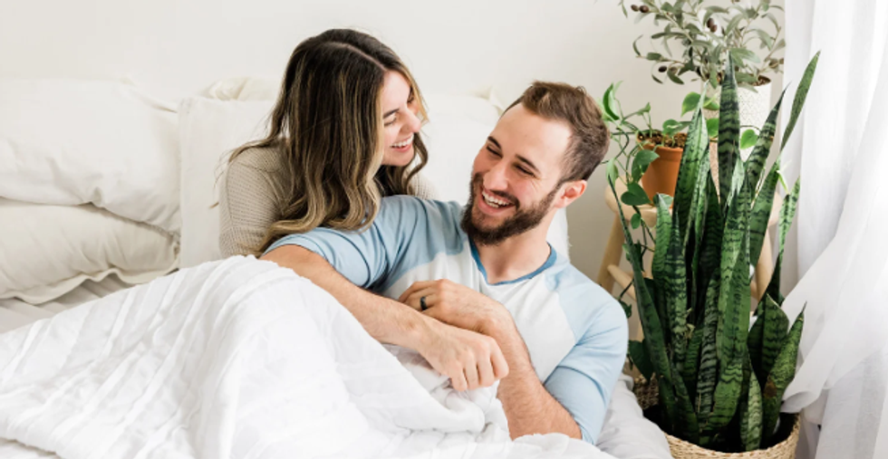 happy coupe, couple in bed, young married couple, man with beard, smiling woman
