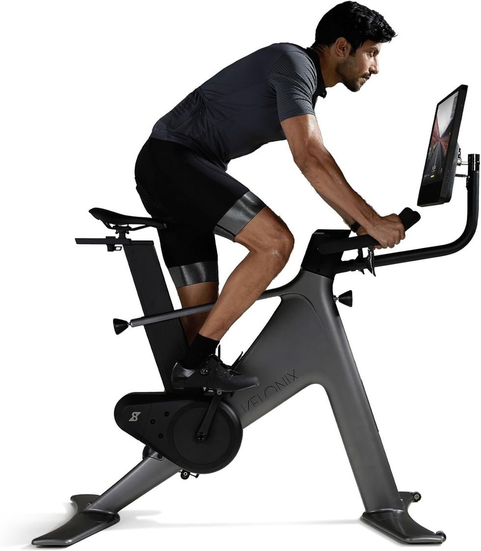 photo of a man on VeloNix exercise bike with AI