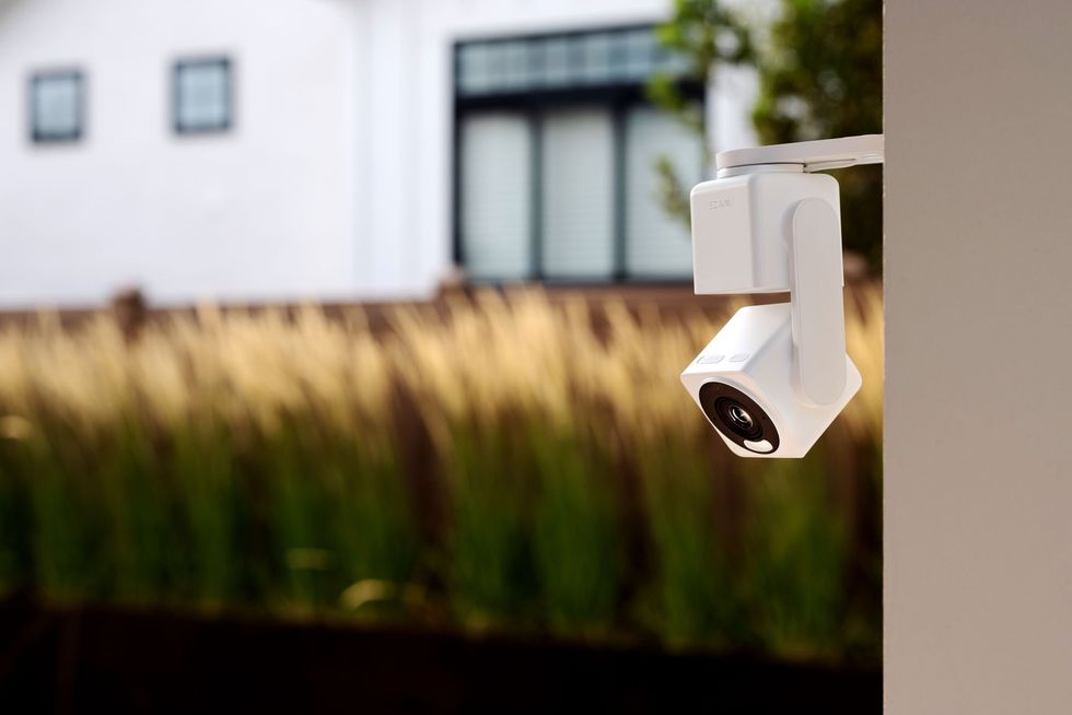 a photo of Wyze Cam Pan v4 installed outside a home.